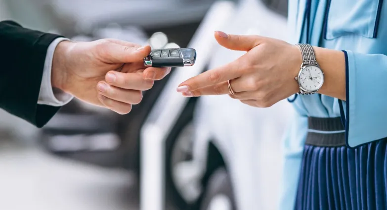 Services Car Rent female hands close up with car keys