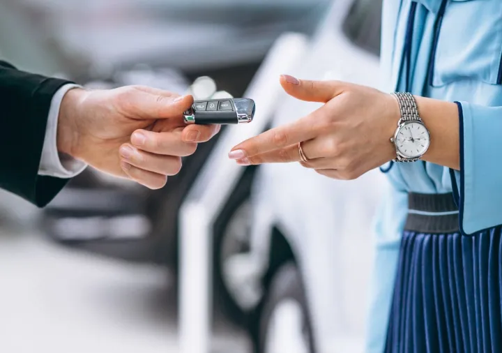 Services Car Rent female hands close up with car keys